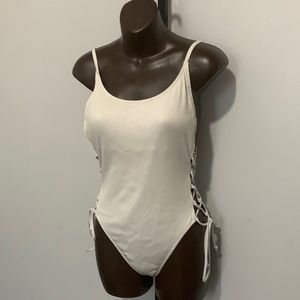 Lace-up white bathing suit